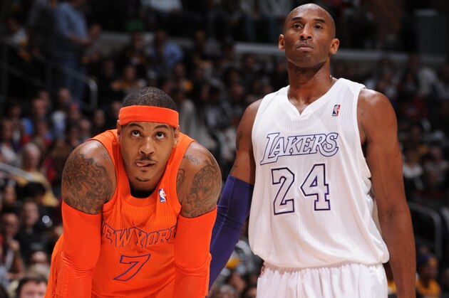 LOS ANGELES, CA - DECEMBER 25: Carmelo Anthony #7 of the New York Knicks and Kobe Bryant #24 of the Los Angeles Lakers look on during their game at Staples Center on December 25, 2012 in Los Angeles, California. NOTE TO USER: User expressly acknowledges and agrees that, by downloading and/or using this Photograph, user is consenting to the terms and conditions of the Getty Images License Agreement. Mandatory Copyright Notice: Copyright 2012 NBAE (Photo by Andrew D. Bernstein/NBAE via Getty Images)