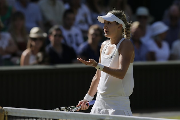 Eugenie Bouchard of Canada disputes a line call with the umpire as she plays against Simona Halep of Romania during their women's singles semifinal match at the All England Lawn Tennis Championships in Wimbledon, London, Thursday, July 3, 2014. (AP Photo/Pavel Golovkin) Eugenie Bouchard of Canada disputes a line call with the umpire as she plays against Simona Halep of Romania during their women's singles semifinal match at the All England Lawn Tennis Championships in Wimbledon, London, Thursday, July 3, 2014. (AP Photo/Pavel Golovkin)