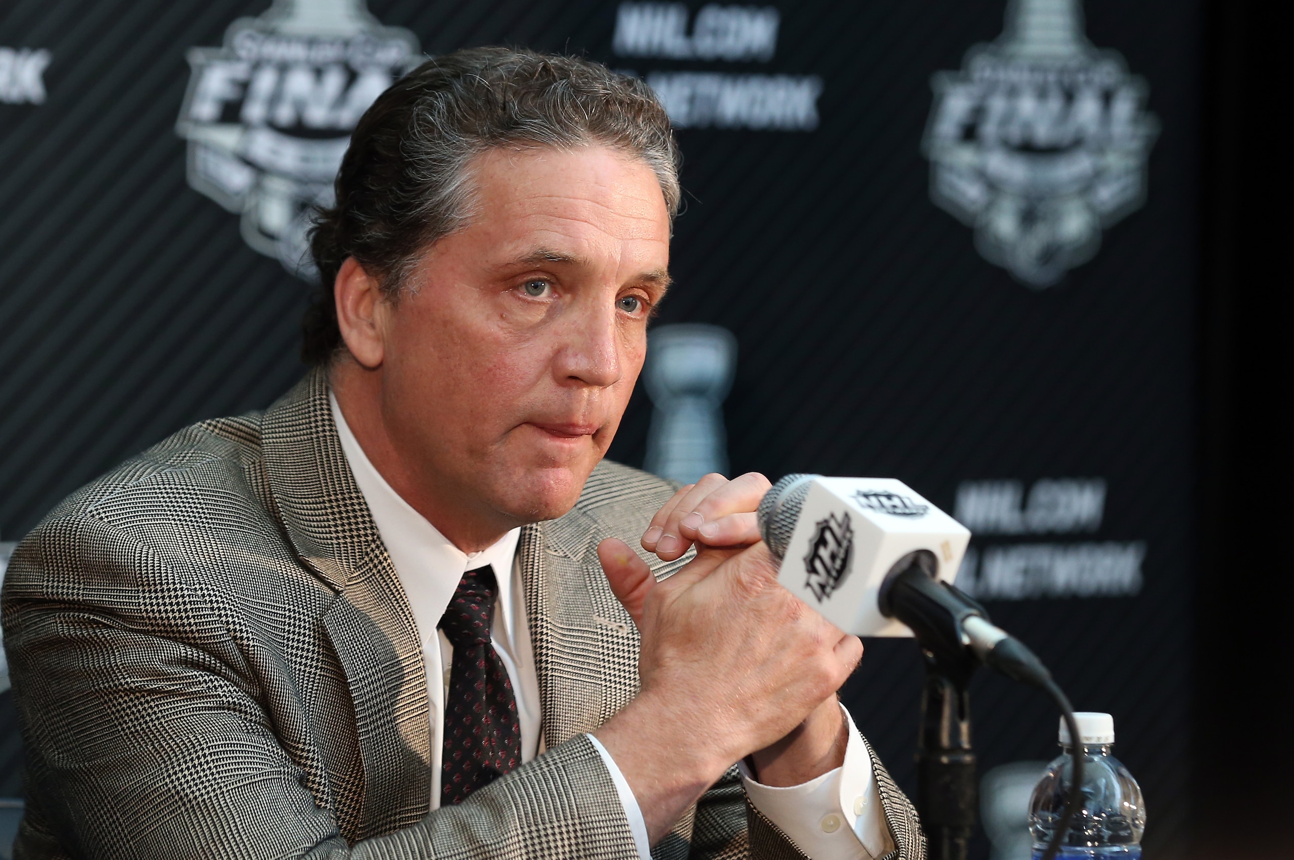 LOS ANGELES, CA - JUNE 03:  Dean Lombardi, President and General Manager of the Los Angeles Kings, speaks during Media Day for the 2014 NHL Stanley Cup Final at Staples Center on June 3, 2014 in Los Angeles, California.  (Photo by Bruce Bennett/Getty Images)