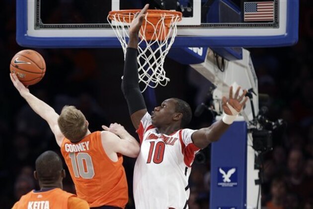 Syracuse's Trevor Cooney (10) drives past Louisville's Gorgui Dieng (10) during the first half of an NCAA college basketball championship game at the Big East Conference tournament Saturday, March 16, 2013, in New York. (AP Photo/Frank Franklin II) Syracuse's Trevor Cooney (10) drives past Louisville's Gorgui Dieng (10) during the first half of an NCAA college basketball championship game at the Big East Conference tournament Saturday, March 16, 2013, in New York. (AP Photo/Frank Franklin II)