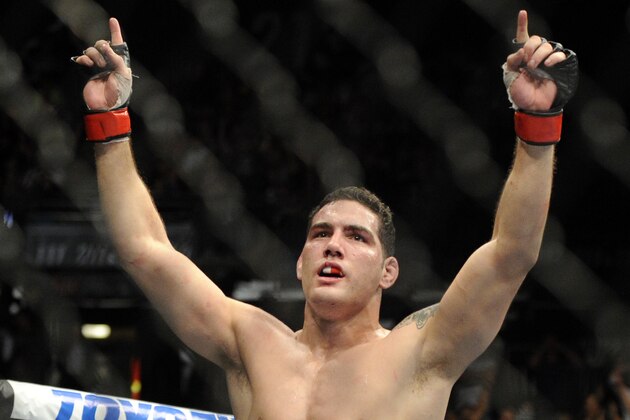 Chris Weidman of Baldwin, N.Y., celebrates after defeating Anderson Silva, of Brazil, during the UFC 168 mixed martial arts middleweight championship bout on Saturday, Dec. 28, 2013, in Las Vegas. Weidman won during the second round. (AP Photo/David Becker)