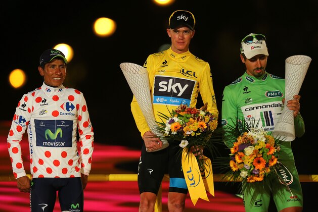 PARIS, FRANCE - JULY 21:  Winner of the 2013 Tour de France, Chris Froome of Great Britain and SKY Procycling (C) celebrates alongside second placed, best young rider and King of the Mountain Nairo Quintana of Colombia and Movistar Team and winner of the Green Jersey Points Classification Peter Sagan of Slovakia and Cannondale on the podium after the twenty first and final stage of the 2013 Tour de France, a processional 133.5KM road stage ending in an evening race around the Champs-Elysees, on July 21, 2013 in Paris, France.  (Photo by Bryn Lennon/Getty Images)
