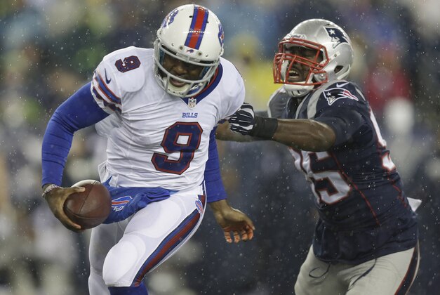 Buffalo Bills quarterback Thad Lewis (9) scrambles away from New England Patriots defensive end Chandler Jones (95) in the first quarter of an NFL football game Sunday, Dec. 29, 2013, in Foxborough, Mass. (AP Photo/Steven Senne)