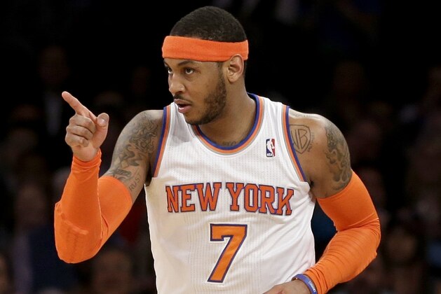New York Knicks' Carmelo Anthony points after sinking a basket during the first half against the Indiana Pacers in an NBA basketball game at Madison Square Garden, Wednesday, March 19, 2014, in New York. (AP Photo/Seth Wenig)