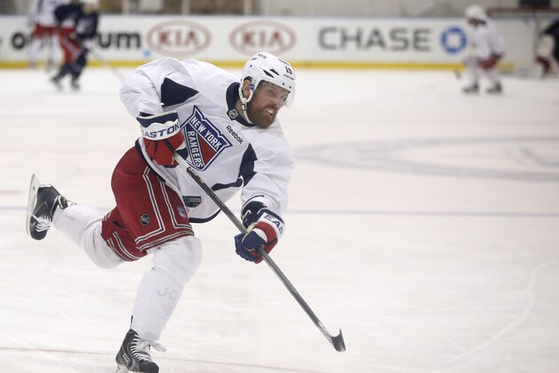 New York Rangers center Brad Richards (19) takes a shot on goal during a practice for the Stanley Cup Finals at the team's training facility in Greenburgh, N.Y., Sunday, June 1, 2014. (AP Photo/Kathy Willens)