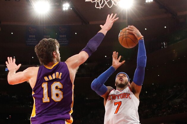 Jan 26, 2014; New York, NY, USA;  New York Knicks small forward Carmelo Anthony (7) shoots the ball as Los Angeles Lakers center Pau Gasol (16) defends during the fourth quarter at Madison Square Garden. The Knicks won 110-103. Mandatory Credit: Anthony Gruppuso-USA TODAY Sports