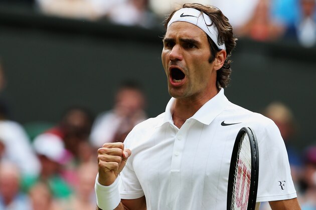 LONDON, ENGLAND - JULY 02:  Roger Federer of Switzerland celebrates during his Gentlemen's Singles quarter-final match against Stan Wawrinka of Switzerland on day nine of the Wimbledon Lawn Tennis Championships at the All England Lawn Tennis and Croquet Club  at Wimbledon on July 2, 2014 in London, England.  (Photo by Jan Kruger/Getty Images)