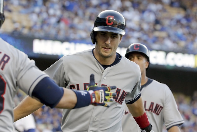 Cleveland Indians' Lonnie Chisenhall, right, celebrates his two run home run with Nick Swisher during the first inning of a baseball game in Los Angeles, Tuesday, July 1, 2014. (AP Photo/Chris Carlson)