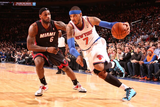 NEW YORK, NY - JANUARY 9: Carmelo Anthony #7 of the New York Knicks drives against LeBron James #6 of the Miami Heat during a game at Madison Square Garden in New York City on January 9, 2014.  NOTE TO USER: User expressly acknowledges and agrees that, by downloading and or using this photograph, User is consenting to the terms and conditions of the Getty Images License Agreement. Mandatory Copyright Notice: Copyright 2014 NBAE  (Photo by Nathaniel S. Butler/NBAE via Getty Images)