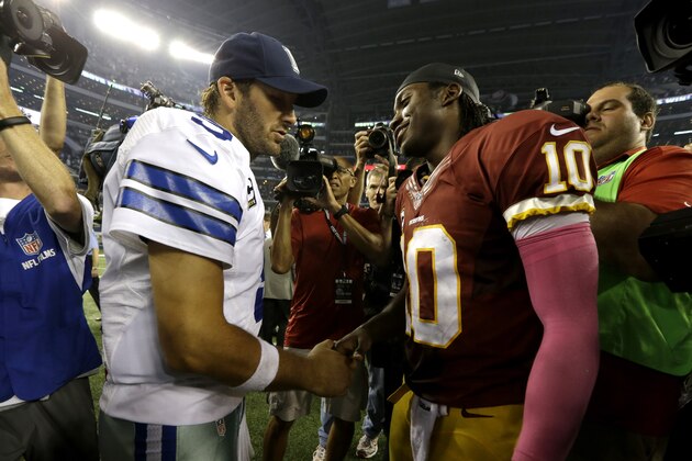 Dallas Cowboys quarterback Tony Romo (9) an Washington Redskins quarterback Robert Griffin III (10) greet each other after their NFL football game, Sunday, Oct. 13, 2013, in Arlington, Texas. The Cowboys won 31-16. (AP Photo/LM Otero)