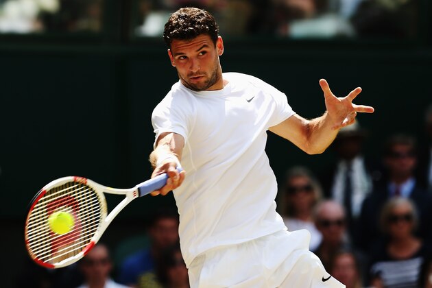 LONDON, ENGLAND - JULY 02:  Grigor Dimitrov of Bulgaria plays a forehand return during his Gentlemen's Singles quarter-final match against Andy Murray of Great Britain on day nine of the Wimbledon Lawn Tennis Championships at the All England Lawn Tennis and Croquet Club  at Wimbledon on July 2, 2014 in London, England.  (Photo by Matthew Stockman/Getty Images)