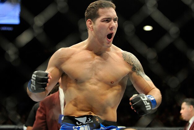 Chris Weidman reacts after knocking down Anderson Silva during the second round of their UFC 162 mixed martial arts middleweight championship bout at the MGM Grand Garden Arena on Saturday, July 6, 2013, in Las Vegas. (AP Photo/David Becker)