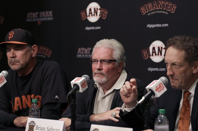 San Francisco Giants CEO Larry Baer, right, gestures beside general manager Brian Sabean, center, and coach Bruce Bochy during a media conference, Thursday, March 28, 2013, in San Francisco.  The Giants announced contract extensions for Sabean and Bochy through 2016. (AP Photo/Ben Margot)