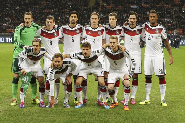 Germany's team standing from left, Manuel Neuer, Toni Kroos, Sami Khedira, Benedikt Howedes, Marcell Jansen, Mats Hummels, Jerome Boateng, kneeling from left, Philipp Lahm,  Mario Gotze, Thomas Muller, Andre Schurrle, prior to the start of a friendly soccer match between Italy and Germany at the San Siro  stadium in Milan, Italy, Friday, Nov. 15, 2013. (AP Photo/Antonio Calanni)