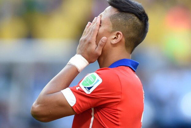 June 28, 2014; Belo Horizonte, BRAZIL; Chile player Alexis Sanchez reacts after failing to convert a penalty kick against Brazil during the round of sixteen match in the 2014 World Cup at Estadio Mineirao.  Mandatory Credit: Tim Groothuis/Witters Sport via USA TODAY Sports