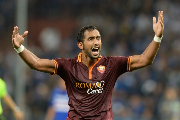 GENOA, ITALY - SEPTEMBER 25:  Mehdi Amine Benatia of AS Roma celebrates scoring the first goal during the Serie A match between UC Sampdoria and AS Roma at Stadio Luigi Ferraris on September 25, 2013 in Genoa, Italy.  (Photo by Claudio Villa/Getty Images)