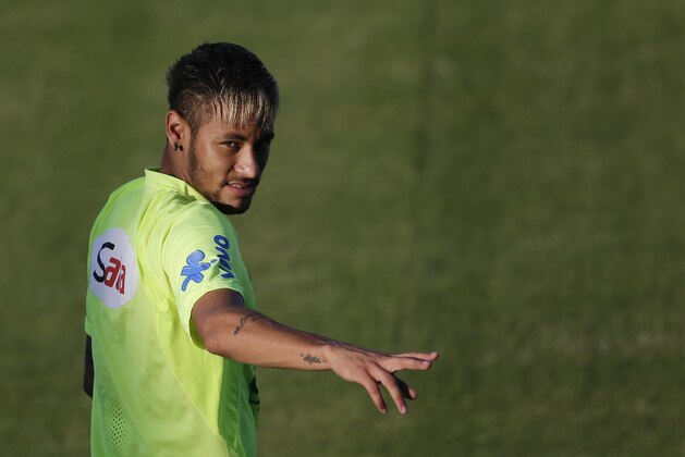 Brazil's Neymar gestures during a training session in Fortaleza, Brazil, Thursday, July 3, 2014. Brazil will face Colombia on Friday in a quarterfinal soccer match at the World Cup. (AP Photo/Felipe Dana)