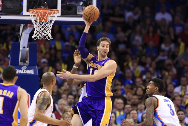 Los Angeles Lakers center Pau Gasol (16) looks to pass against the Oklahoma City Thunder during the second half of an NBA basketball game in Oklahoma City, Thursday, March 13, 2014. Oklahoma City won 131-102. (AP Photo/Alonzo Adams)