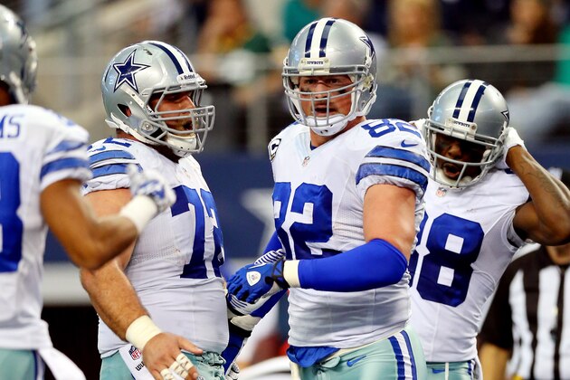 ARLINGTON, TX - DECEMBER 15:  Tight end Jason Witten #82 celebrates a touchdown with wide receiver Dez Bryant #88 and center Travis Frederick #72 of the Dallas Cowboys against the Green Bay Packers in the first quarter during a game at AT&T Stadium on December 15, 2013 in Arlington, Texas.  (Photo by Ronald Martinez/Getty Images)