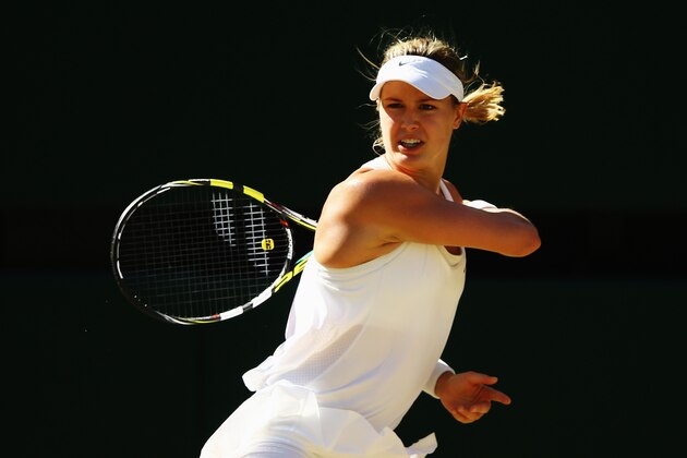 LONDON, ENGLAND - JULY 03:  Eugenie Bouchard of Canada plays a return during her Ladies' Singles semi-final match against Simona Halep of Romania on day ten of the Wimbledon Lawn Tennis Championships at the All England Lawn Tennis and Croquet Club  on July 3, 2014 in London, England.  (Photo by Al Bello/Getty Images)