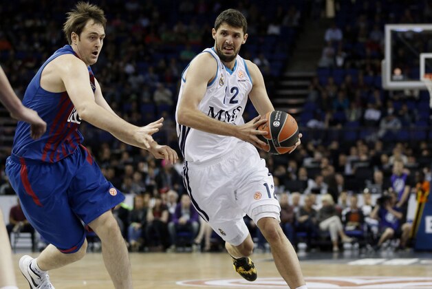 Real Madrid's Nikola Mirotic, right, dribbles past Barcelona Regal's Erazem Lorbek, left, during a Euroleague Final-Four semi-final basketball game at the O2 Arena, in London, Friday, May 10, 2013. (AP Photo/Lefteris Pitarakis) Real Madrid's Nikola Mirotic, right, dribbles past Barcelona Regal's Erazem Lorbek, left, during a Euroleague Final-Four semi-final basketball game at the O2 Arena, in London, Friday, May 10, 2013. (AP Photo/Lefteris Pitarakis)