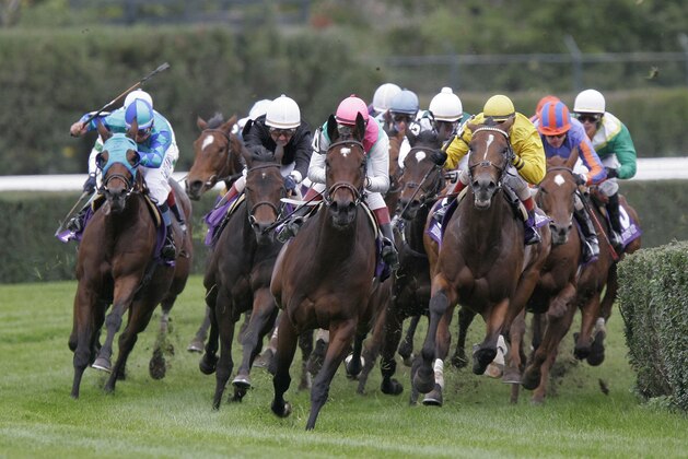Intercontinental, center, with Rafael Bejarano up, leads the field around the turn on his way to winning the Breeders' Cup Filly & Mare Turf race at Belmont Park in Elmont, N.Y., Saturday, Oct. 29, 2005. (AP Photo/Peter Morgan)