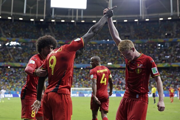 Belgium's Romelu Lukaku, left, celebrates with Kevin De Bruyne after scoring his side's second goal during the World Cup round of 16 soccer match between Belgium and the USA at the Arena Fonte Nova in Salvador, Brazil, Tuesday, July 1, 2014. (AP Photo/Matt Dunham)