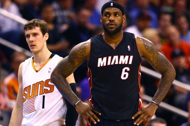 Feb 11, 2014; Phoenix, AZ, USA; Miami Heat forward LeBron James (6) against Phoenix Suns guard Goran Dragic (1) at the US Airways Center. Mandatory Credit: Mark J. Rebilas-USA TODAY Sports