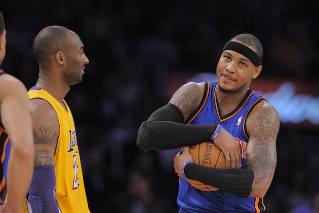 Los Angeles Lakers guard Kobe Bryant, left, and New York Knicks forward Carmelo Anthony prior to their NBA basketball game, Thursday, Dec. 29, 2011, in Los Angeles. The Lakers won 99-82.  (AP Photo/Mark J. Terrill)