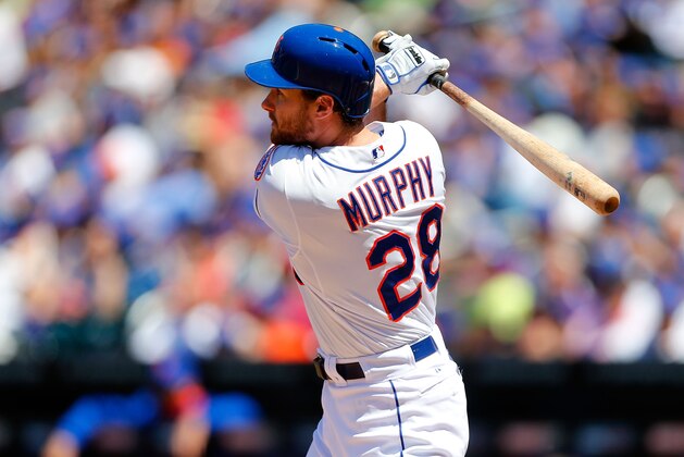 NEW YORK, NY - JUNE 15:  Daniel Murphy #28 of the New York Mets follows through on a second inning run scoring sacrifice fly against the San Diego Padres at Citi Field on June 15, 2014 in the Flushing neighborhood of the Queens borough of New York City.  (Photo by Jim McIsaac/Getty Images)