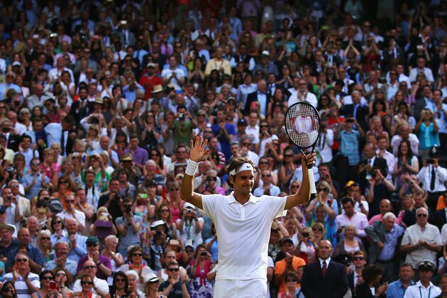 LONDON, ENGLAND - JULY 04:  Roger Federer of Switzerland celebrates after winning his Gentlemen's Singles semi-final match against Milos Raonic of Canada on day eleven of the Wimbledon Lawn Tennis Championships at the All England Lawn Tennis and Croquet Club on July 4, 2014 in London, England.  (Photo by Al Bello/Getty Images)