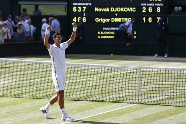 Novak Djokovic of Serbia celebrates defeating Grigor Dimitrov of Bulgaria in their men's singles semifinal match at the All England Lawn Tennis Championships in Wimbledon, London, Friday, July 4, 2014. (AP Photo/Ben Curtis)