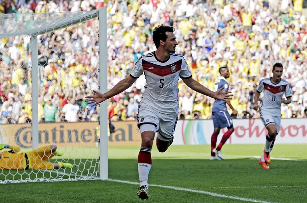 Germany's Mats Hummels celebrates after scoring his side's first goal during the World Cup quarterfinal soccer match between Germany and France at the Maracana Stadium in Rio de Janeiro, Brazil, Friday, July 4, 2014.  (AP Photo/Matthias Schrader)