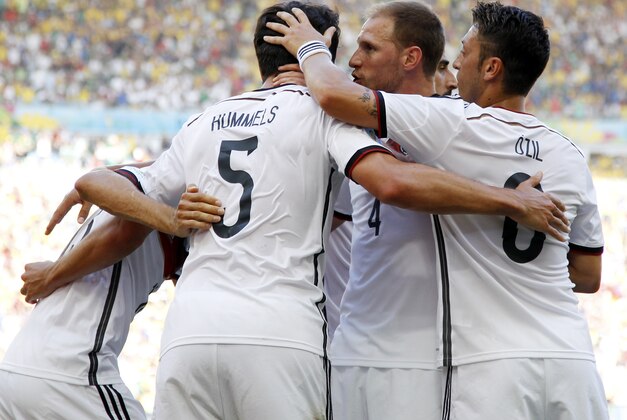 Germany's Mats Hummels (5) celebrates with his teammates after scoring his side's first goal during the World Cup quarterfinal soccer match between Germany and France at the Maracana Stadium in Rio de Janeiro, Brazil, Friday, July 4, 2014. (AP Photo/Matthias Schrader) Germany's Mats Hummels (5) celebrates with his teammates after scoring his side's first goal during the World Cup quarterfinal soccer match between Germany and France at the Maracana Stadium in Rio de Janeiro, Brazil, Friday, July 4, 2014. (AP Photo/Matthias Schrader)
