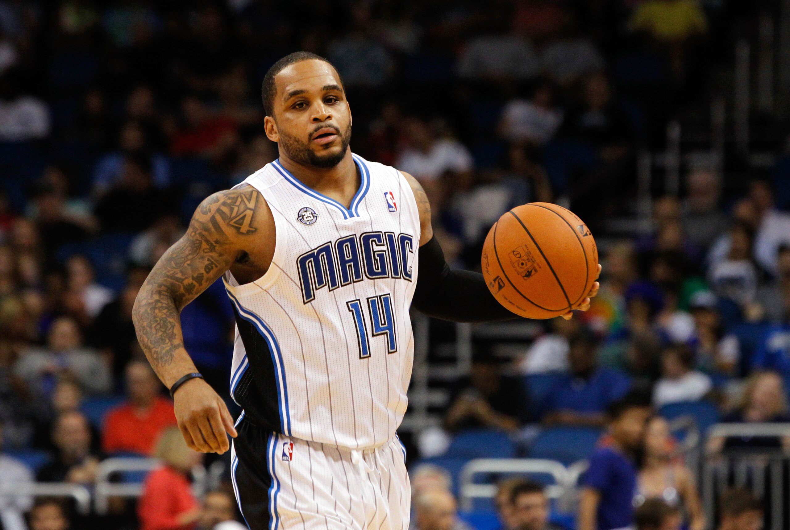 Mar 12, 2014; Orlando, FL, USA; Orlando Magic guard Jameer Nelson (14) drives to the basket against the Denver Nuggets during the second half at Amway Center. Denver Nuggets defeated the Orlando Magic 120-112. Mandatory Credit: Kim Klement-USA TODAY Sports