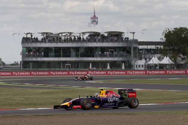 Australia's Daniel Riccardo of Red Bull rounds the track during a practice session before the British Formula One Grand Prix at Silverstone circuit, Silverstone, England, Friday, July 4, 2014. The British Formula One Grand Prix will be held on Sunday July 6, 2014. (AP Photo/Jon Super)