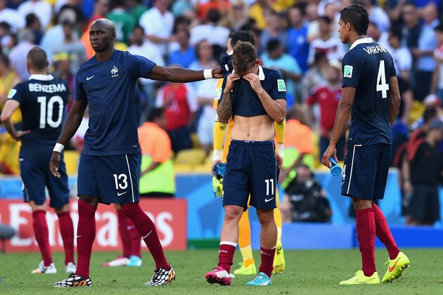 RIO DE JANEIRO, BRAZIL - JULY 04: (L-R) Eliaquim Mangala, Antoine Griezmann and Raphael Varane of France react after being defeated by Germany 1-0 during the 2014 FIFA World Cup Brazil Quarter Final match between France and Germany at Maracana on July 4, 2014 in Rio de Janeiro, Brazil.  (Photo by Matthias Hangst/Getty Images)