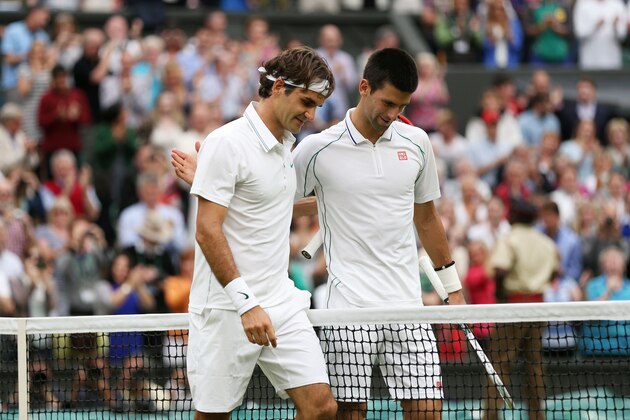 LONDON, ENGLAND - JULY 06:  Roger Federer of Switzerland (L) is congratulated by Novak Djokovic of Serbia after his Gentlemen's Singles semi final match on day eleven of the Wimbledon Lawn Tennis Championships at the All England Lawn Tennis and Croquet Club on July 6, 2012 in London, England.  (Photo by Clive Brunskill/Getty Images)