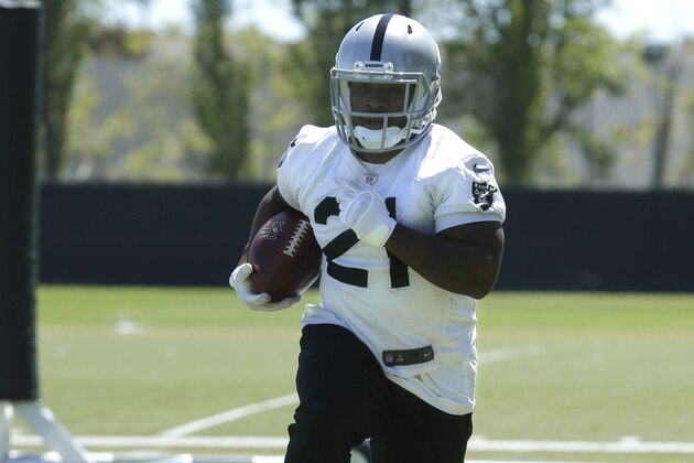 Oakland Raiders running back Maurice Jones-Drew carries the ball during a drill at the Raiders mini-camp in Alameda, Calif., Tuesday, June 17, 2014.(AP Photo/Rich Pedroncelli)