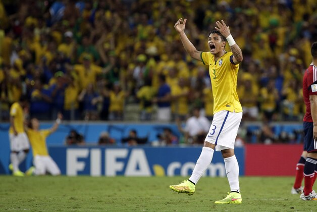Brazil's Thiago Silva  celebrates after David Luiz, second left,  scored his side's second goal during the World Cup quarterfinal soccer match between Brazil and Colombia at the Arena Castelao in Fortaleza, Brazil, Friday, July 4, 2014. (AP Photo/Felipe Dana)