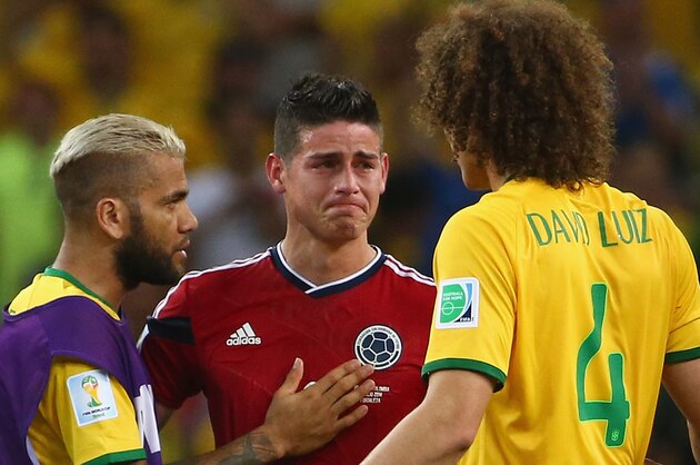 FORTALEZA, BRAZIL - JULY 04:  Dani Alves (L) and David Luiz of Brazil console James Rodriguez of Colombia after Brazil's 2-1 win during the 2014 FIFA World Cup Brazil Quarter Final match between Brazil and Colombia at Castelao on July 4, 2014 in Fortaleza, Brazil.  (Photo by Robert Cianflone/Getty Images)