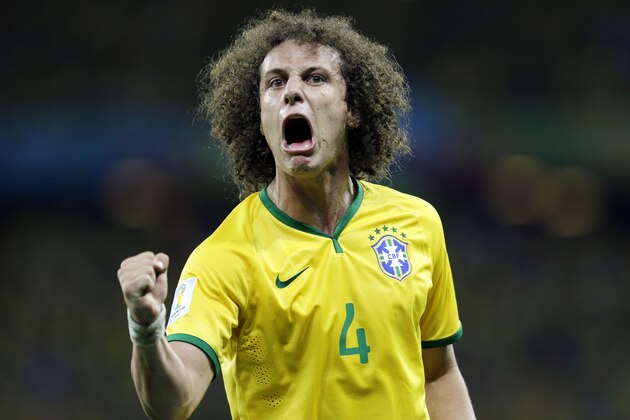 Brazil's David Luiz celebrates after scoring his side's second goal on a free kick during the World Cup quarterfinal soccer match between Brazil and Colombia at the Arena Castelao in Fortaleza, Brazil, Friday, July 4, 2014. (AP Photo/Natacha Pisarenko)