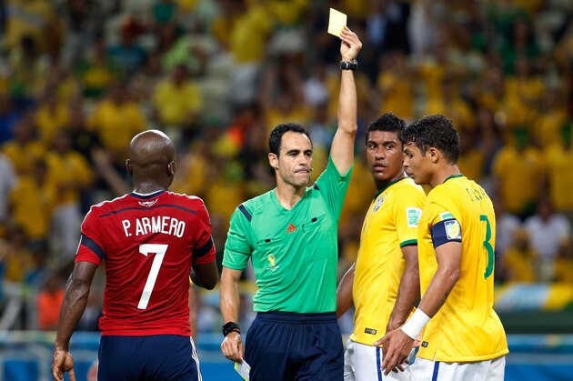 FORTALEZA, BRAZIL - JULY 04: Thiago Silva of Brazil is shown a yellow card by referee Carlos Velasco Carballo during the 2014 FIFA World Cup Brazil Quarter Final match between Brazil and Colombia at Castelao on July 4, 2014 in Fortaleza, Brazil.  (Photo by Gabriel Rossi/Getty Images)