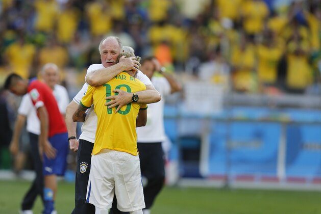 Brazil's coach Luiz Felipe Scolari embraces Brazil's Neymar after the World Cup round of 16 soccer match between Brazil and Chile at the Mineirao Stadium in Belo Horizonte, Brazil, Saturday, June 28, 2014. Brazil won 3-2 on penalties. (AP Photo/Frank Augstein)