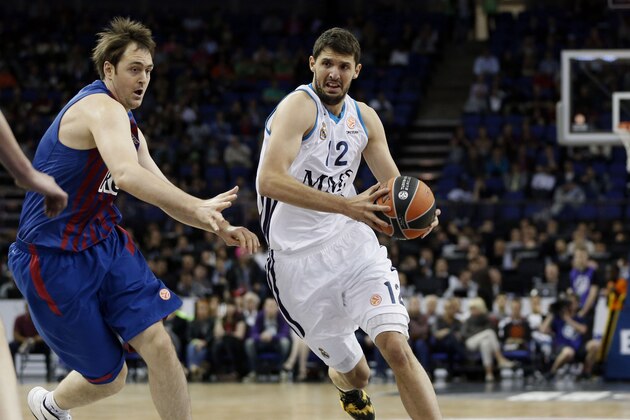 Real Madrid's Nikola Mirotic, right, dribbles past Barcelona Regal's Erazem Lorbek, left, during a Euroleague Final-Four semi-final basketball game at the O2 Arena, in London, Friday, May 10, 2013. (AP Photo/Lefteris Pitarakis) Real Madrid's Nikola Mirotic, right, dribbles past Barcelona Regal's Erazem Lorbek, left, during a Euroleague Final-Four semi-final basketball game at the O2 Arena, in London, Friday, May 10, 2013. (AP Photo/Lefteris Pitarakis)