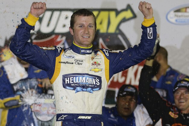 Kasey Kahne celebrates in Victory Lane after winning the NASCAR Nationwide series auto race at Daytona International Speedway in Daytona Beach, Fla., Friday, July 4, 2014. (AP Photo/John Raoux)