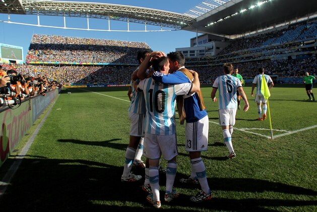 SAO PAULO, BRAZIL - JULY 01:  Angel di Maria of Argentina celebrates with teammates after scoring his team's first goal in extra time during the 2014 FIFA World Cup Brazil Round of 16 match between Argentina and Switzerland at Arena de Sao Paulo on July 1, 2014 in Sao Paulo, Brazil.  (Photo by Julian Finney/Getty Images)