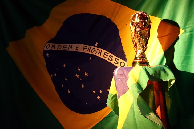 PORTO SEGURO, BRAZIL - JUNE 12:  A replica of the FIFA world cup trophy is displayed during the Group A match between Brazil and Croatia on June 12, 2014 in Porto Seguro, Brazil.  (Photo by Martin Rose/Getty Images)