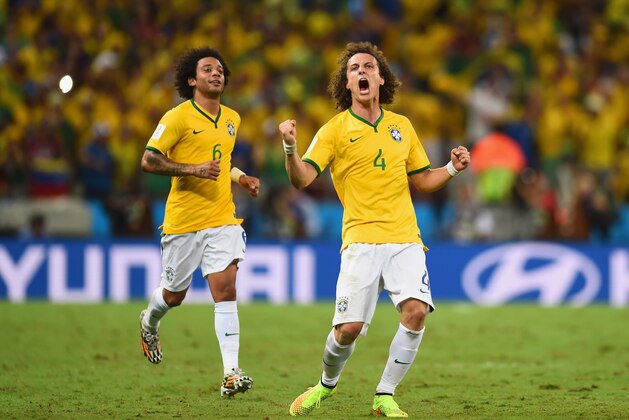 FORTALEZA, BRAZIL - JULY 04:  David Luiz of Brazil (R) celebrates scoring his team's second goal on a free kick with Marcelo during the 2014 FIFA World Cup Brazil Quarter Final match between Brazil and Colombia at Castelao on July 4, 2014 in Fortaleza, Brazil.  (Photo by Jamie McDonald/Getty Images)