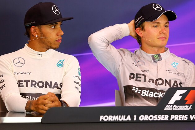 SPIELBERG, AUSTRIA - JUNE 22:  Nico Rosberg (R) of Germany and Mercedes GP sits next to Lewis Hamilton of Great Britain and Mercedes GP in a press conference following his victory in the Austrian Formula One Grand Prix at Red Bull Ring on June 22, 2014 in Spielberg, Austria.  (Photo by Mathias Kniepeiss/Getty Images)